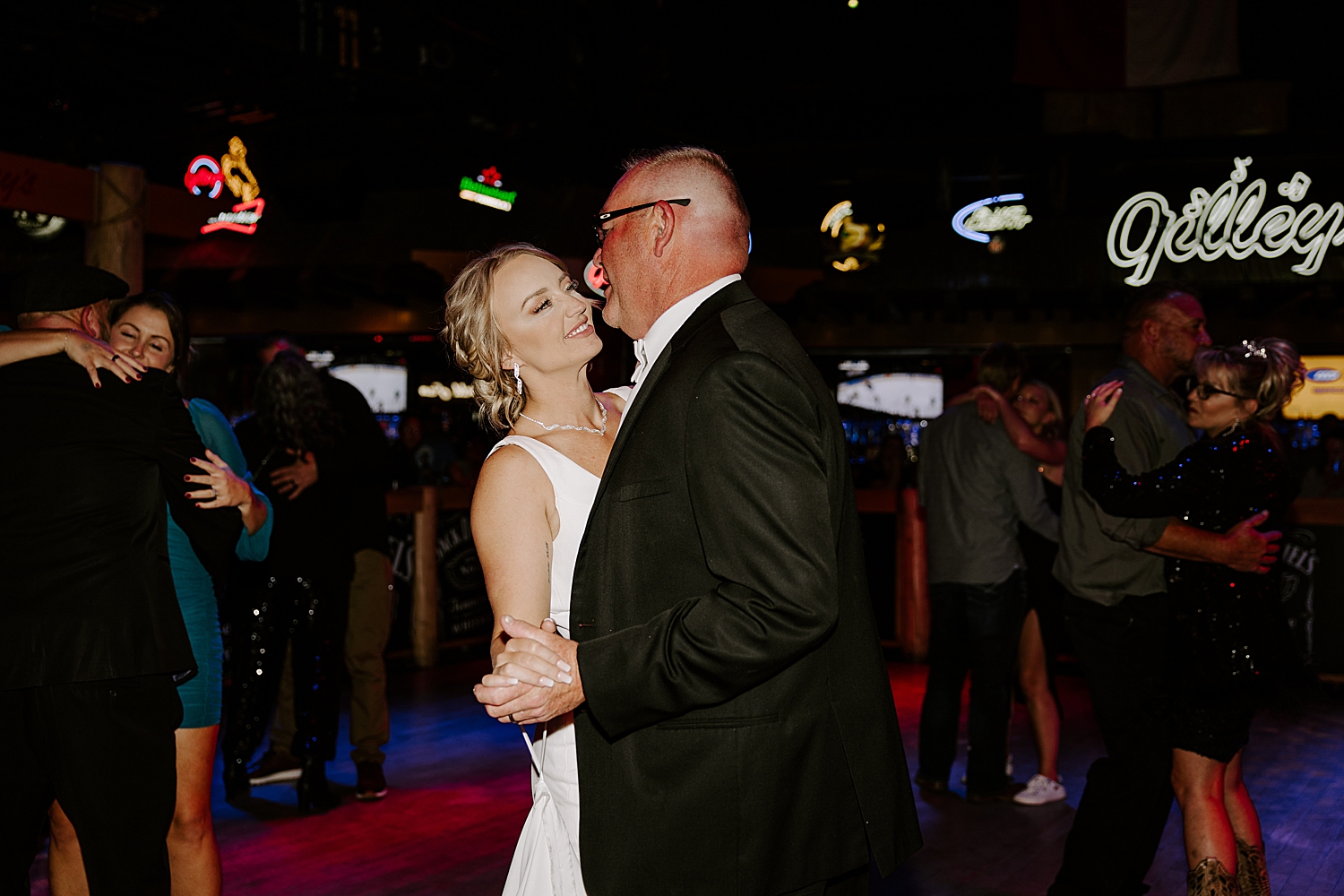 newlyweds share first dance at Gilley's by Las Vegas Wedding Photographer