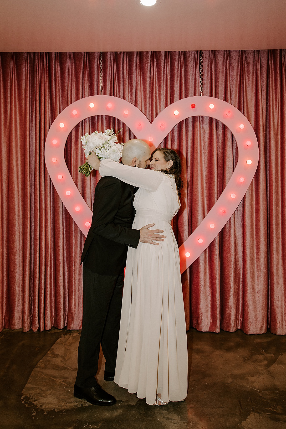 groom dips wife after first kiss by las vegas elopement photographer