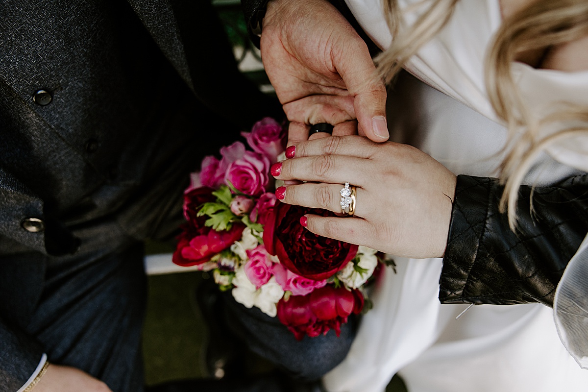 woman's diamond ring on finger by Katelyn Faye Photo