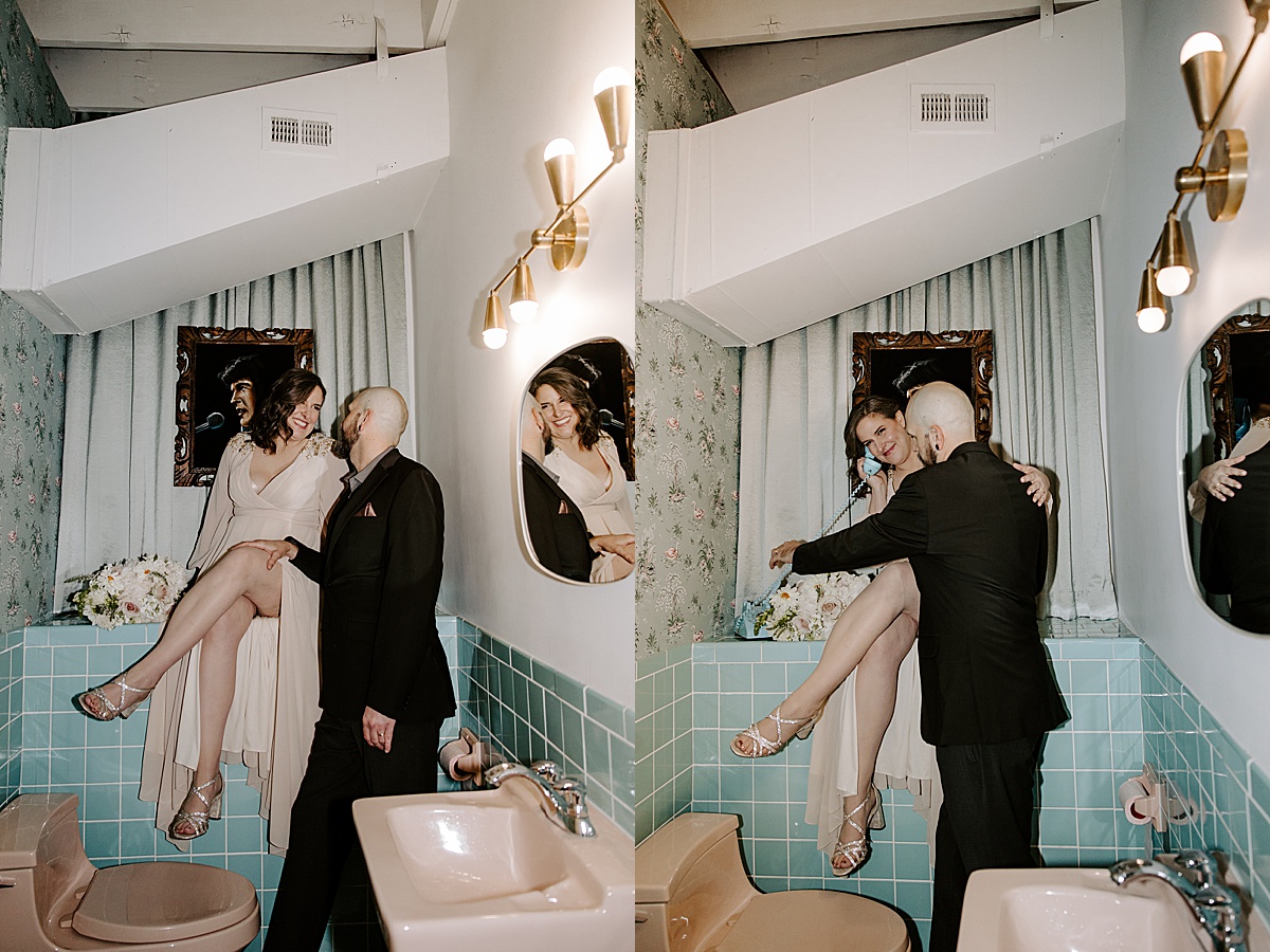 couple joking around in bathroom at intimate chapel elopement