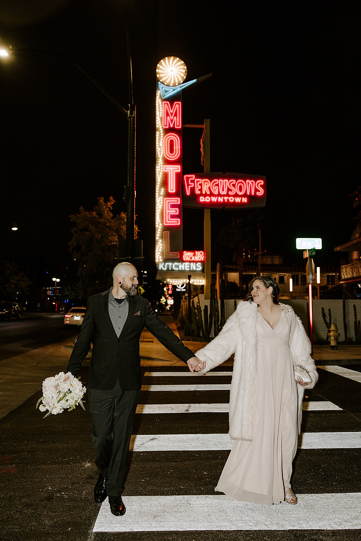 bride and groom crossing the street by katelyn faye photography