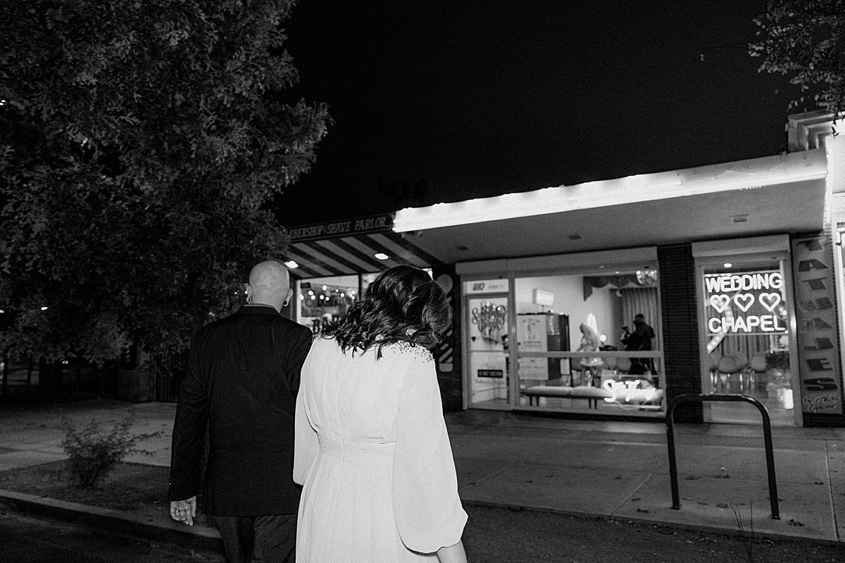 couple exiting the venue after intimate chapel elopement