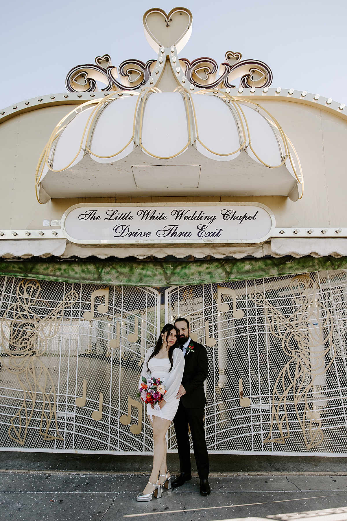 bride looks off into the distance with groom by Katelyn Faye Photo