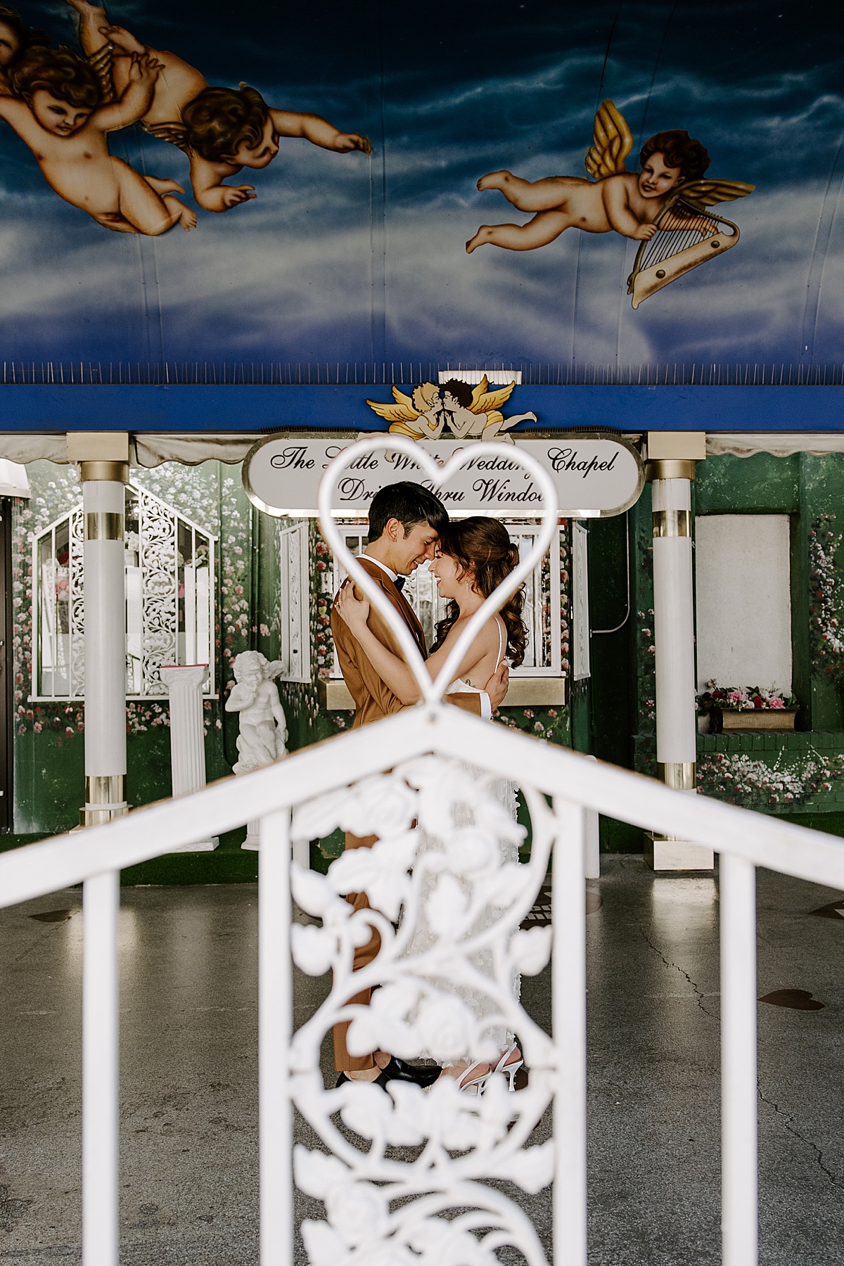 bride and groom look into each other's eyes by las vegas wedding photographer