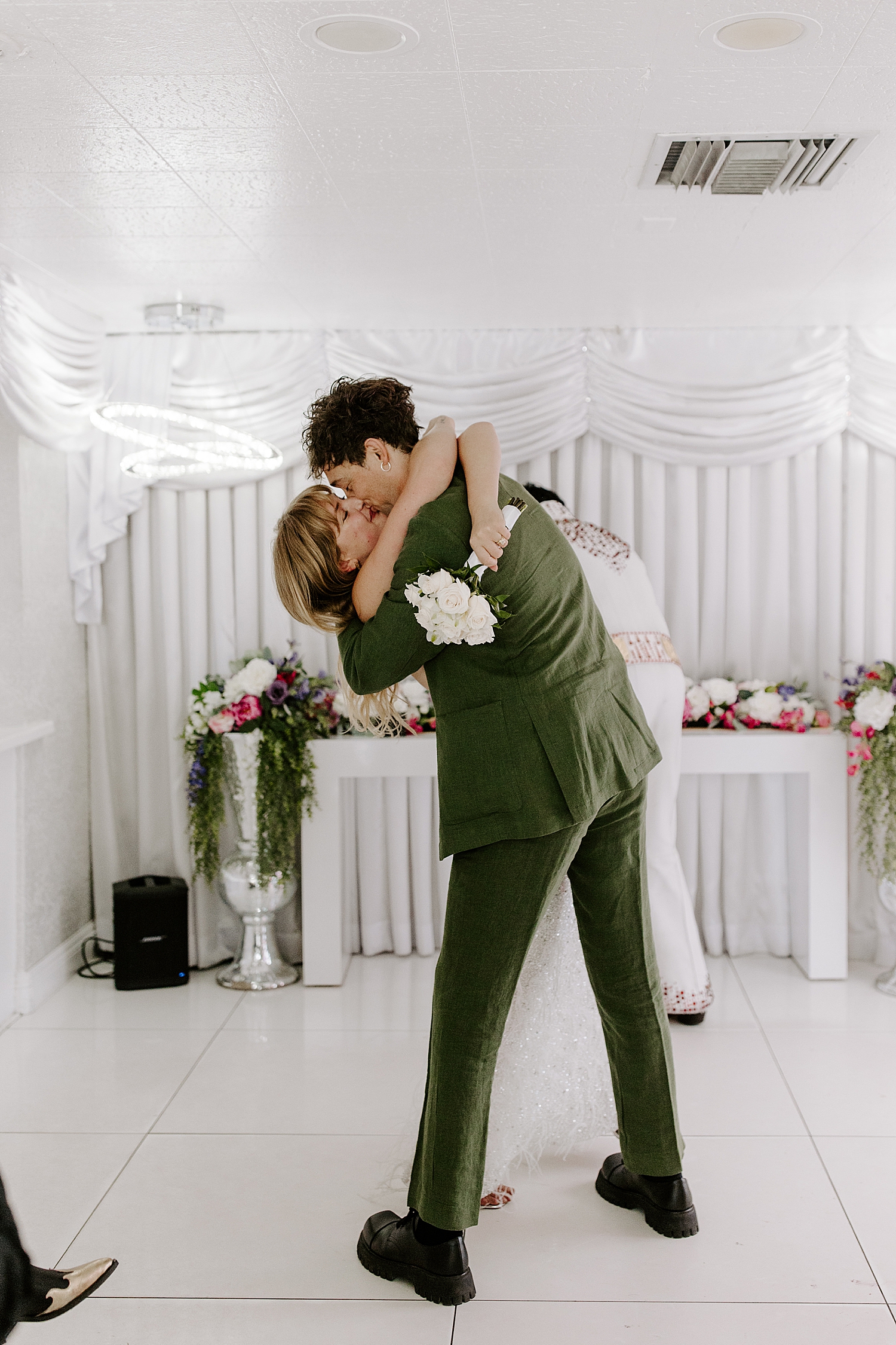 newlyweds kiss at alter before their Bellagio reception