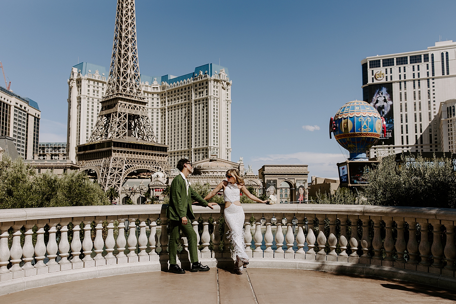 newly married couple stand off strip by Katelyn Faye Photo