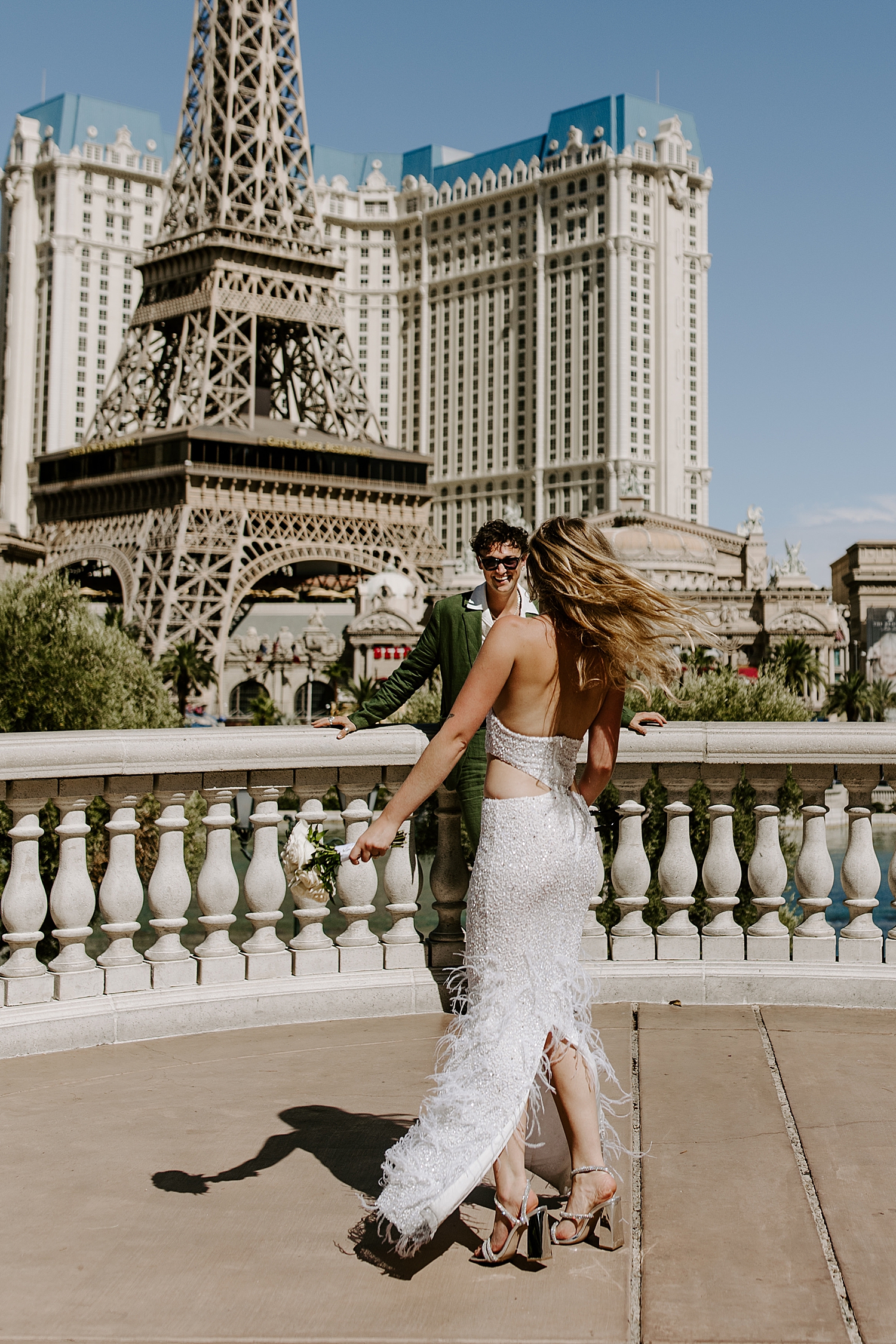 woman dance in her white dress on strip by Katelyn Faye Photo