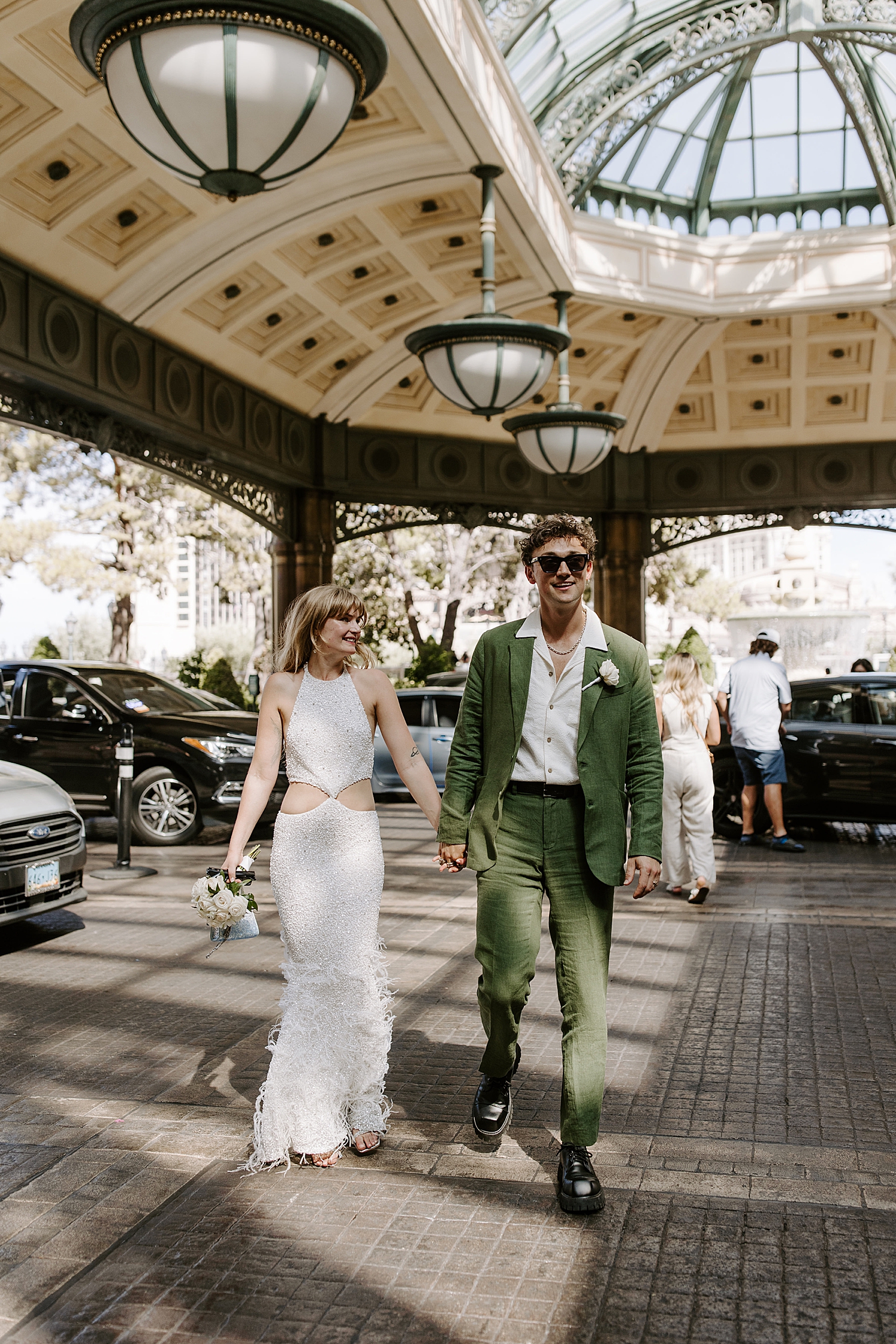 couple walk up the driveway for Bellagio reception