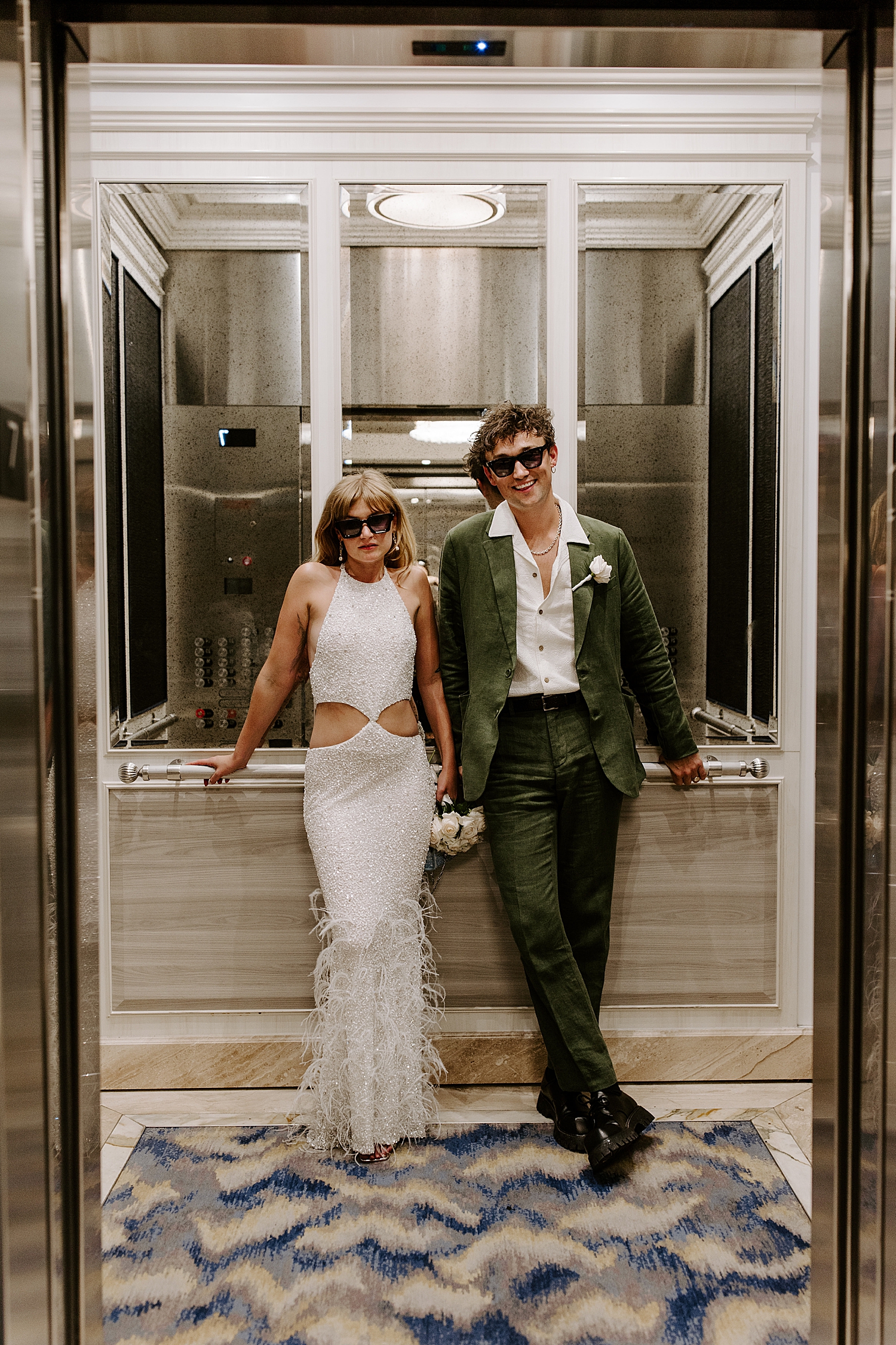 newlywed sit in elevator after saying I Do by Katelyn Faye Photo