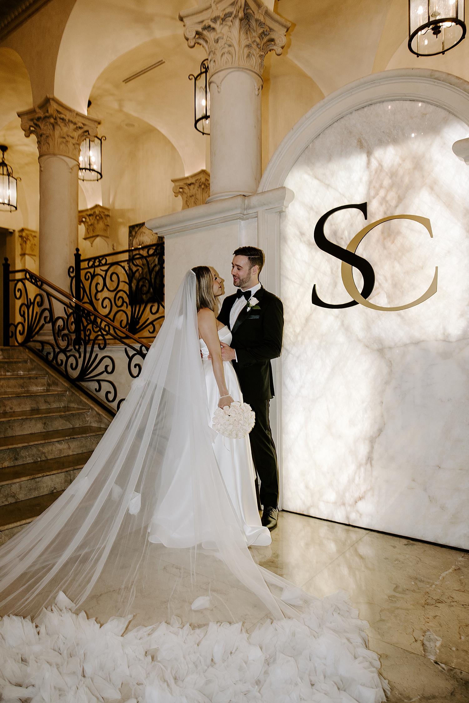 couple embraces next to SC sign by Katelyn Faye Photo