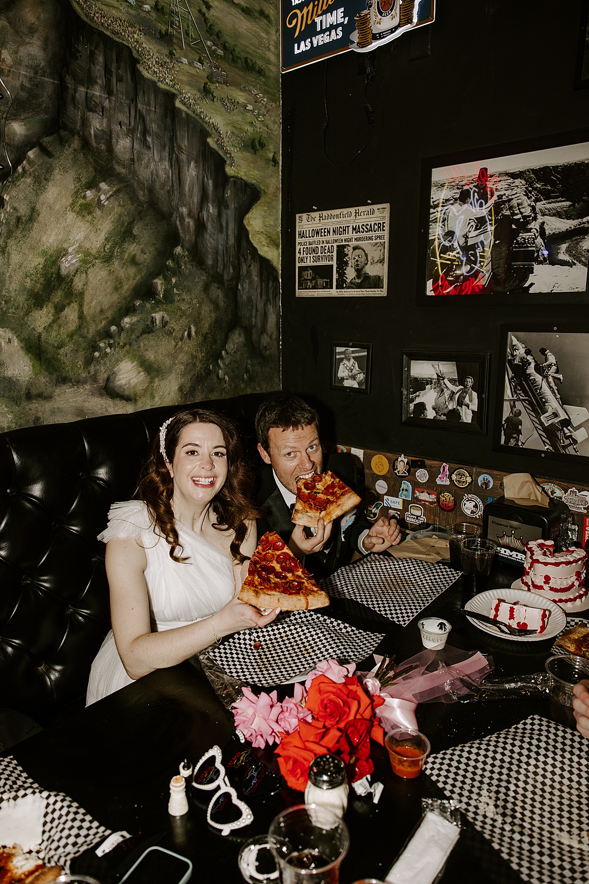 Newly married couple enjoys pizza at their reception by Las Vegas Wedding Photographer