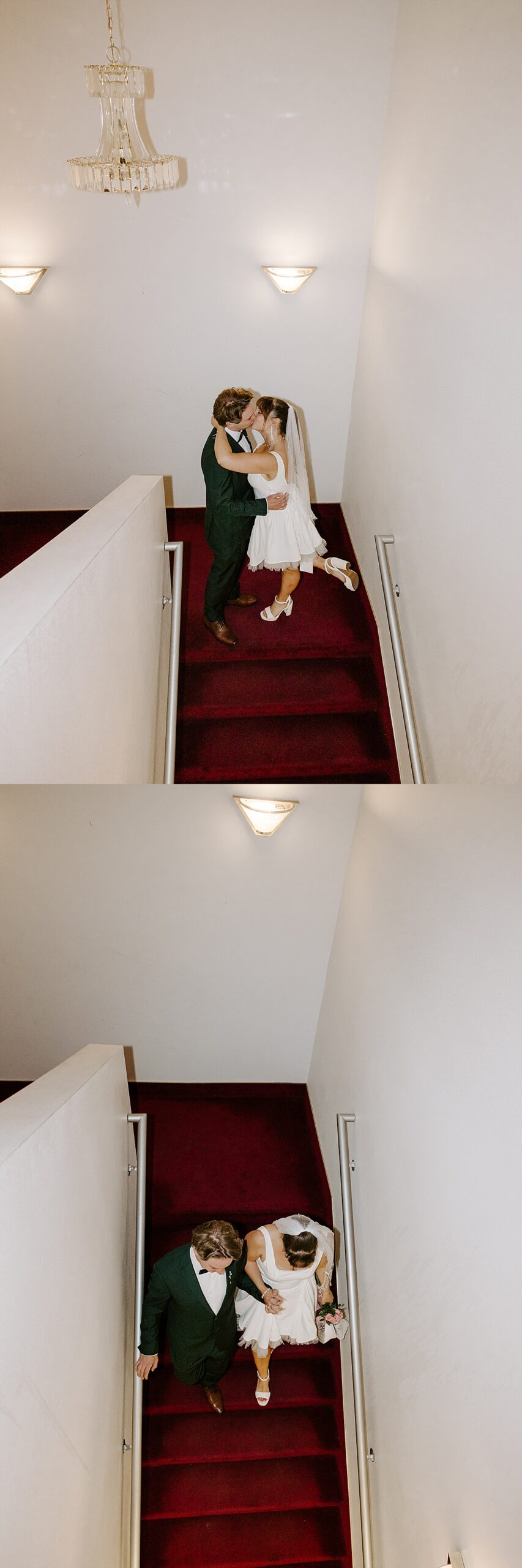 Husband and wife kiss on the red velvet stairwell by Las Vegas wedding photographer