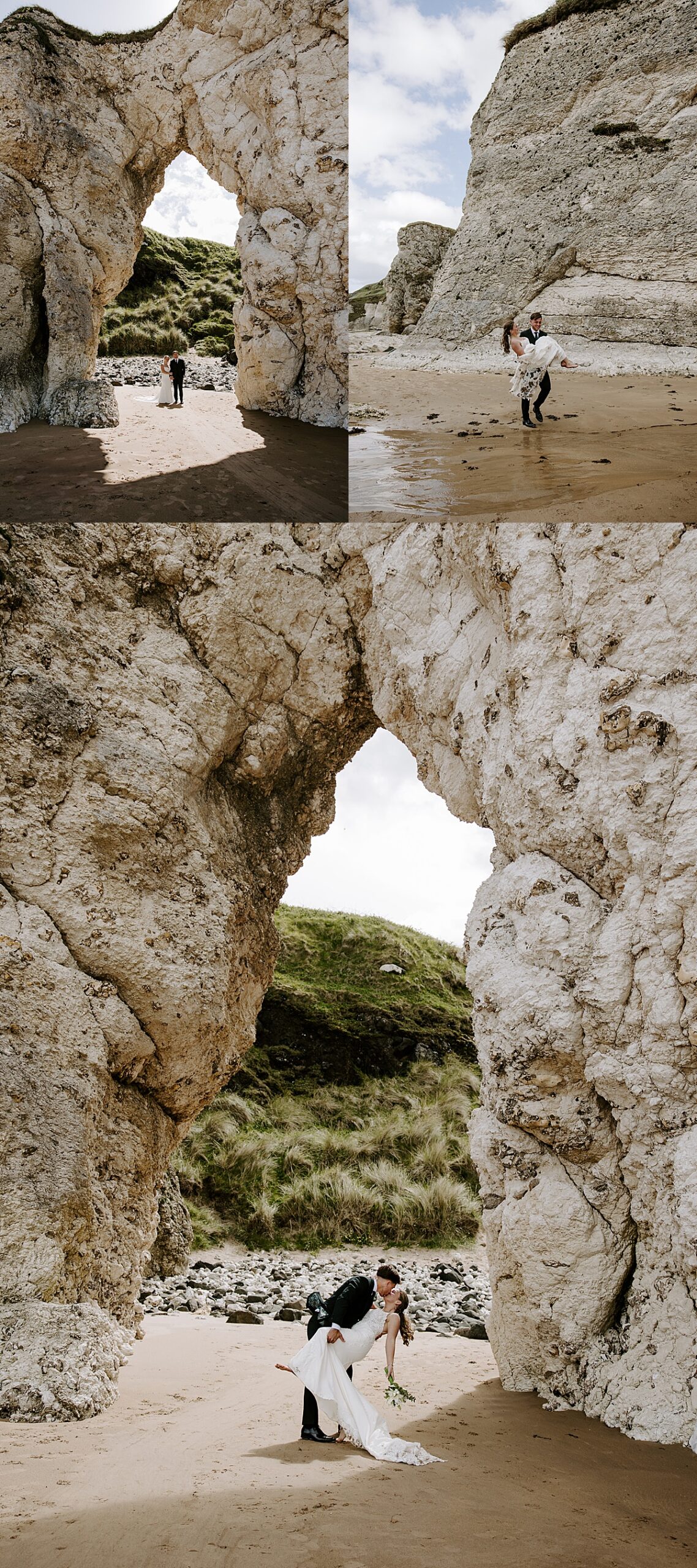 Newlyweds stand under huge rock structure on the beach by Katelyn Faye Photography