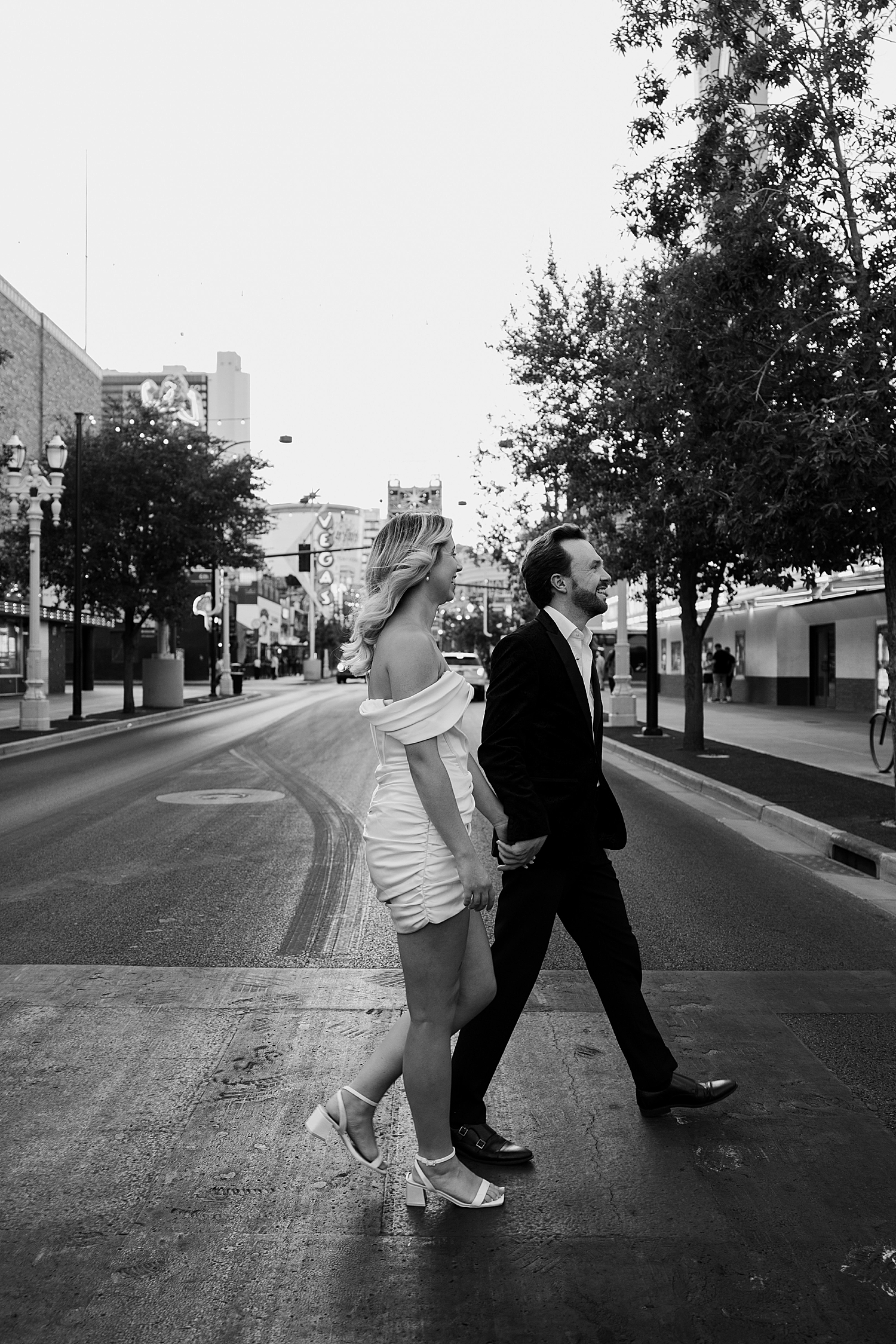 man and woman walk across sidewalk in Nevada by Katelyn Faye Photo