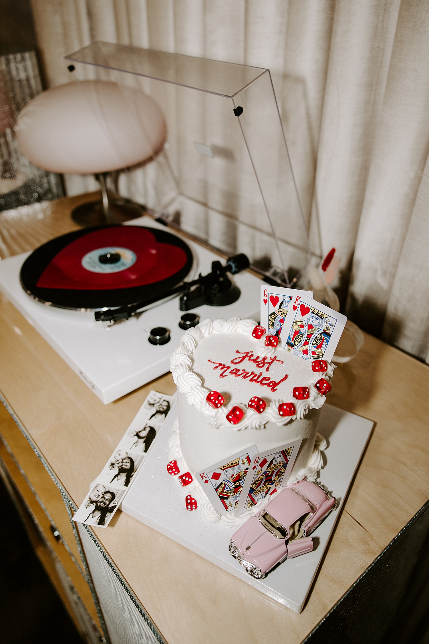 big heart elopement cake next to record player 
