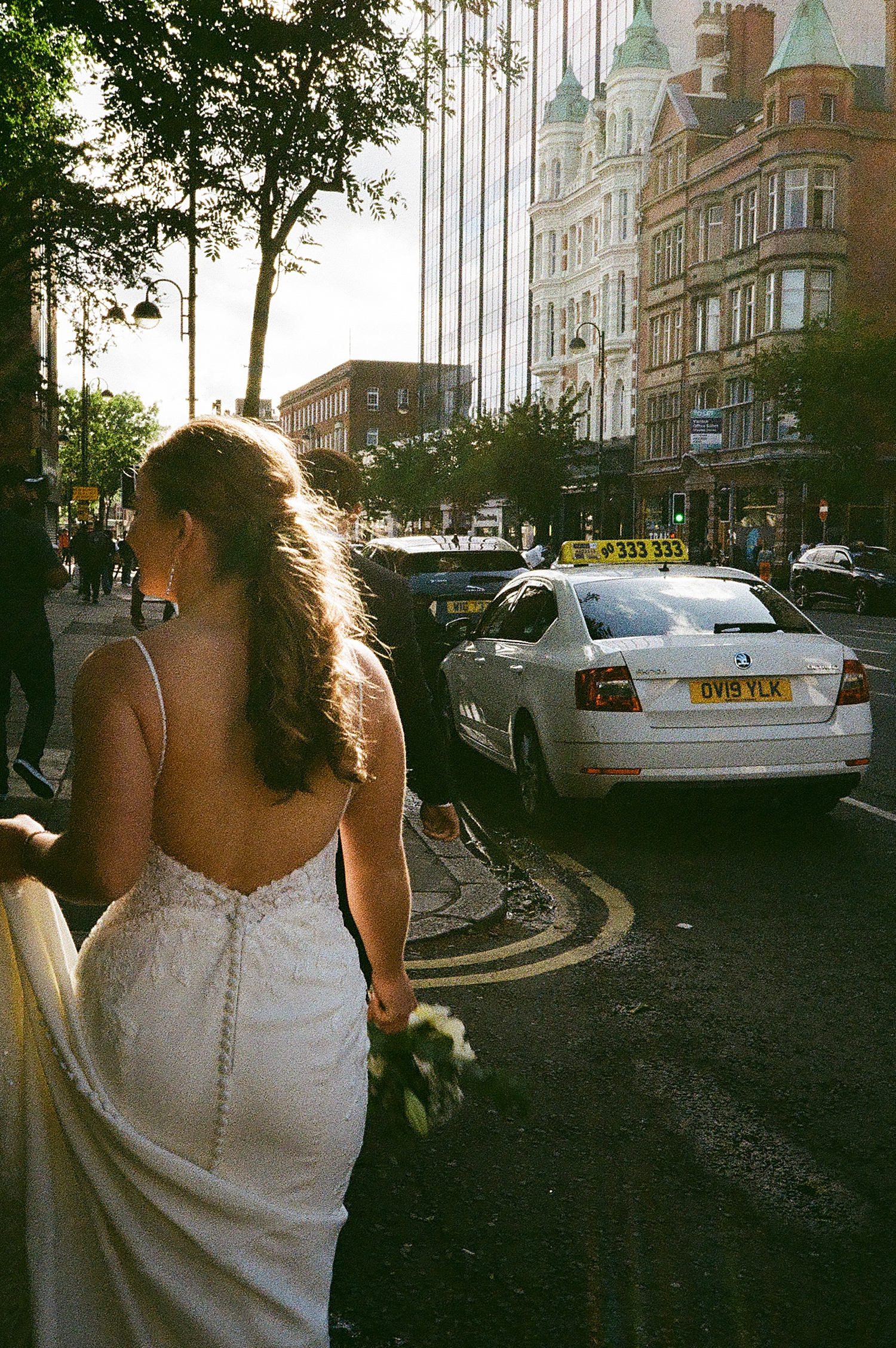 bride walks down NY street in dress by Las vegas wedding photographer