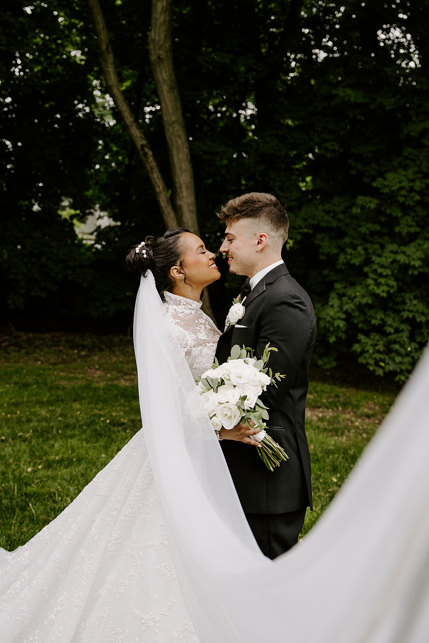 newlyweds grin at each other after saying I Do by Katelyn Faye Photography