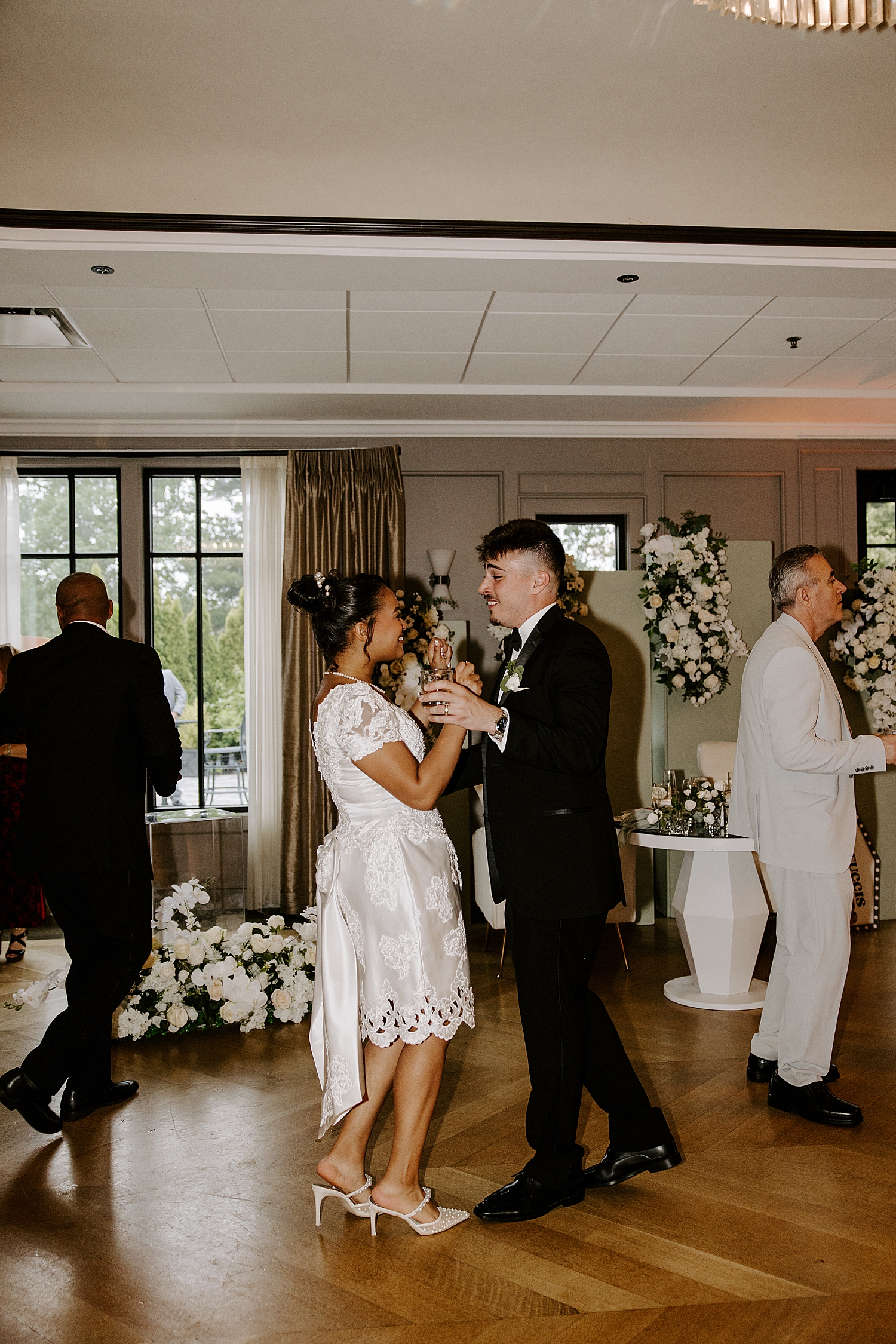 newlyweds share dance on floor for reception by Destination Photographer