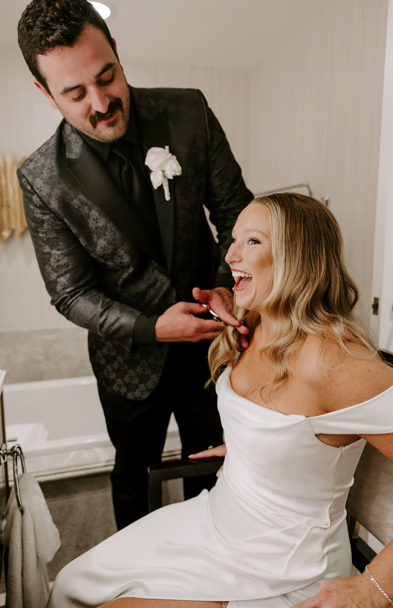 groom chops off bride's hair in post-ceremony haircut by Katelyn Faye Photography