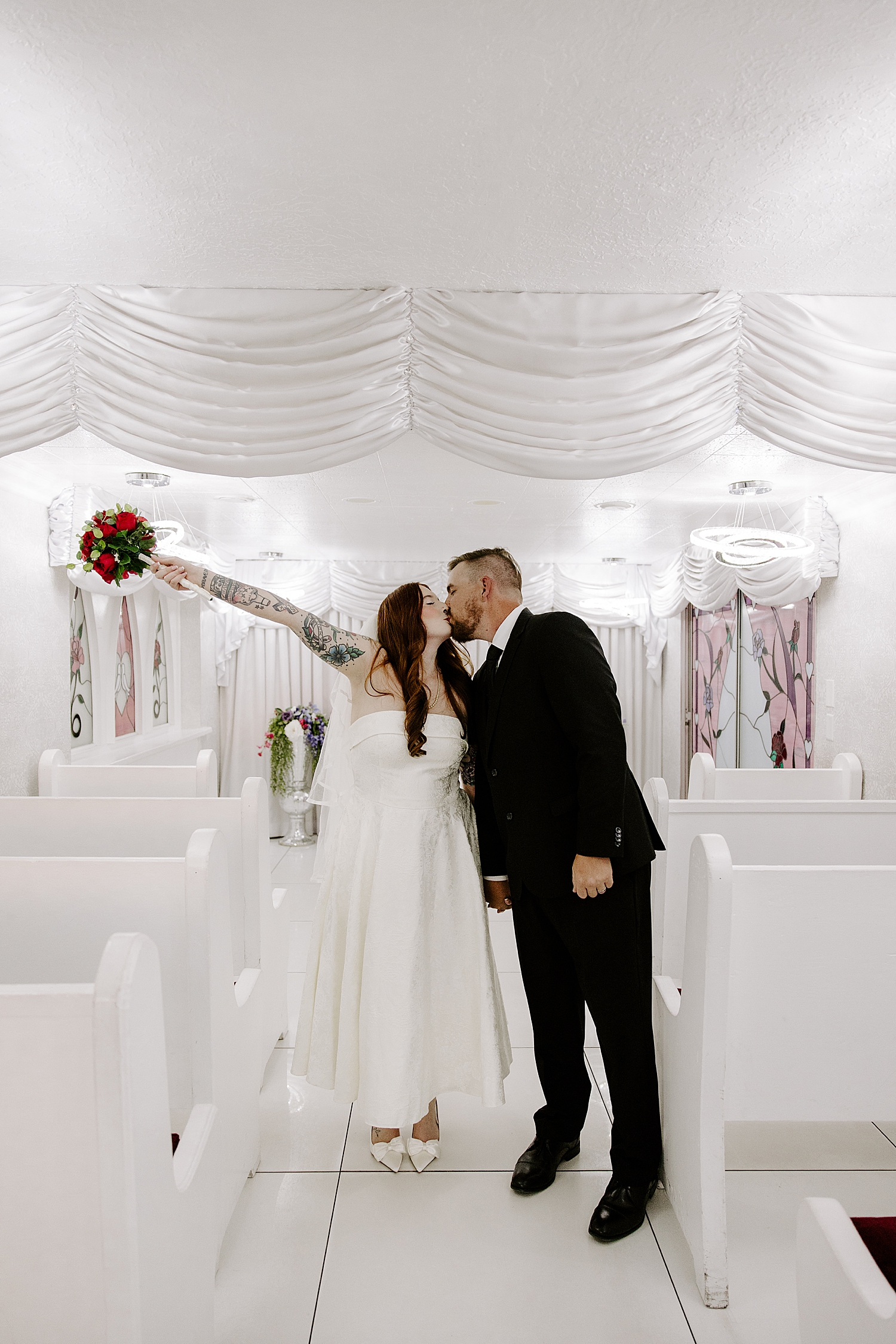 newlyweds throw hands in the air after saying I Do by Katelyn Faye Photo