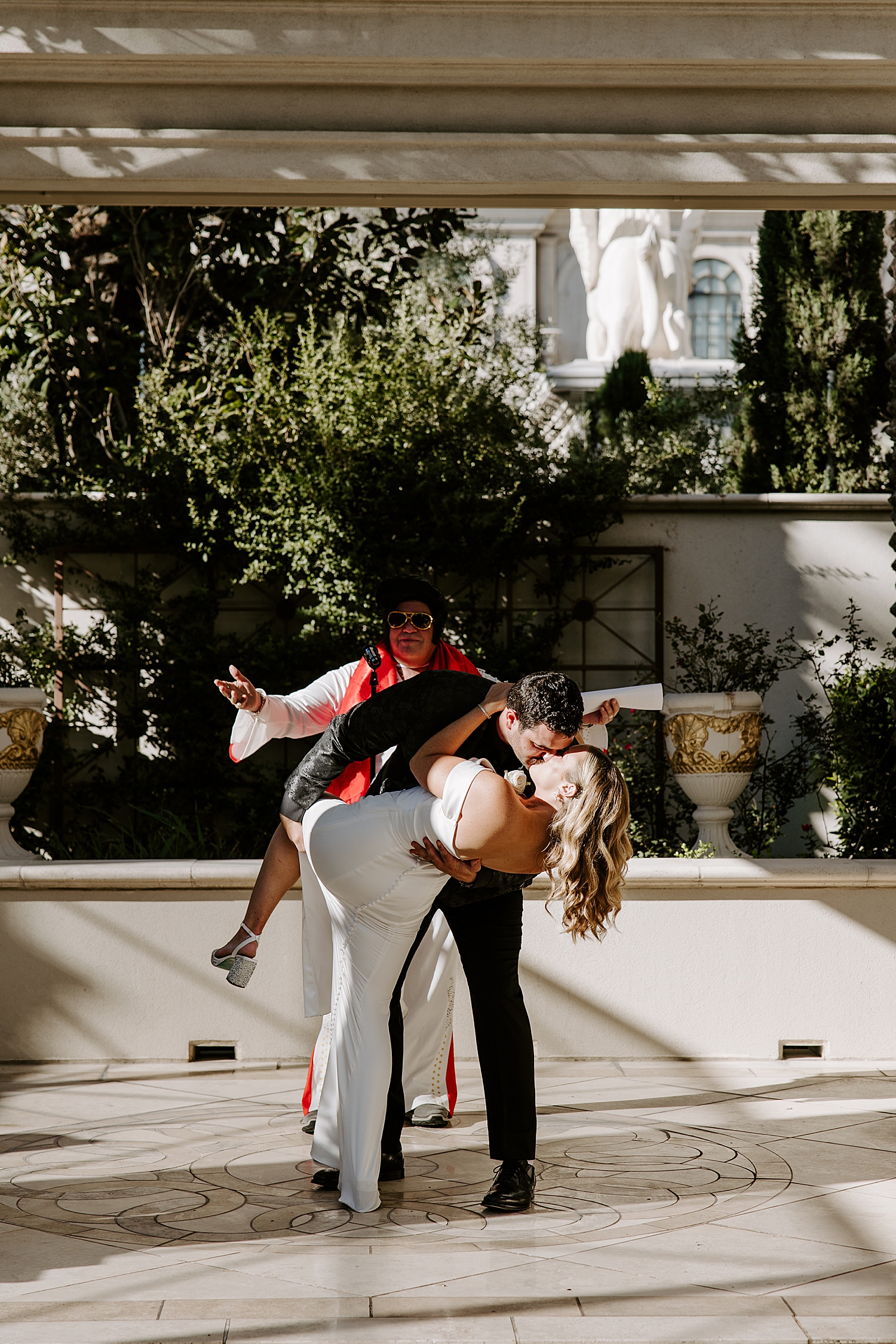man dips his new wife for a kiss at alter at Juno Garden