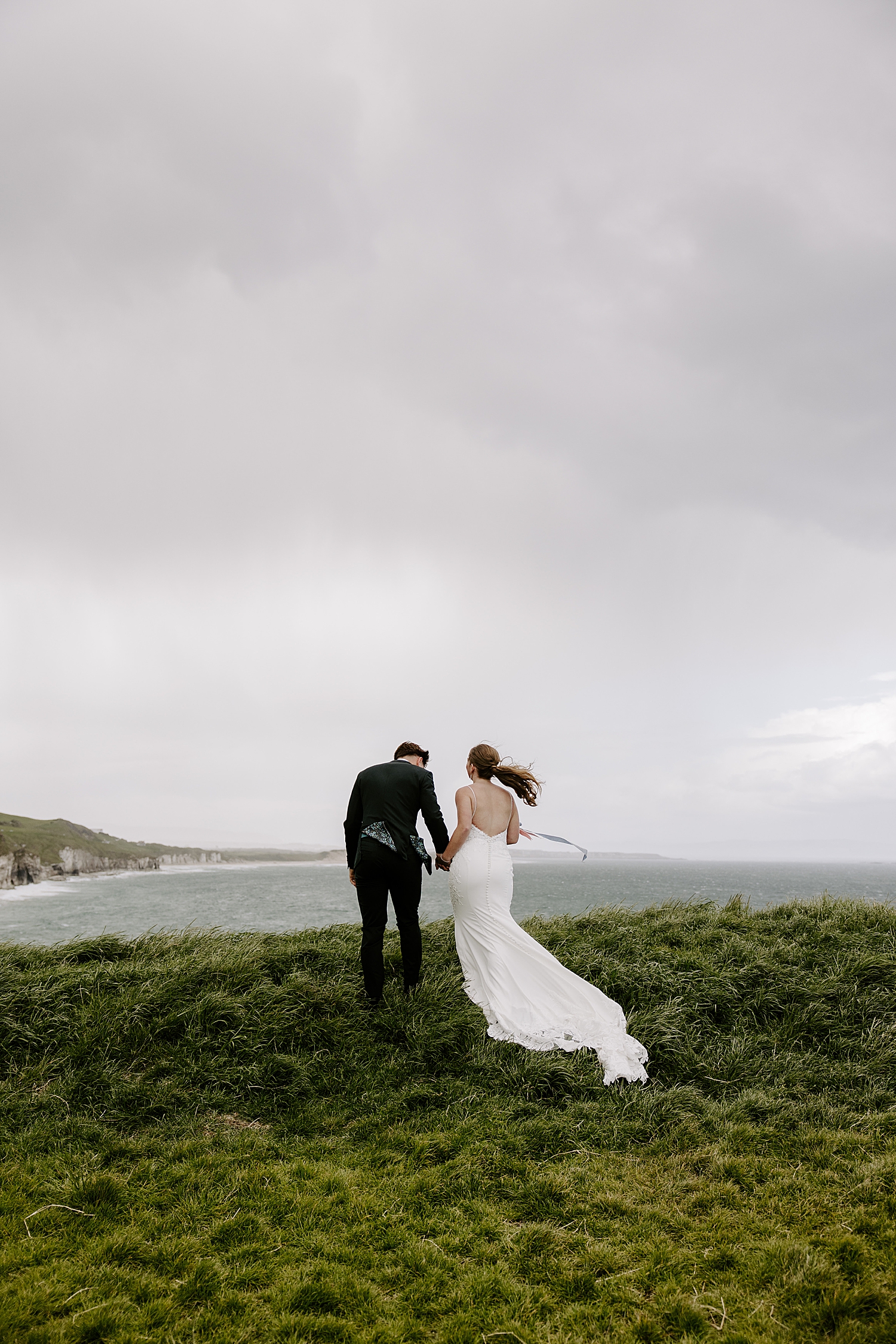 couple stands on irish cliffside during 2025 recap