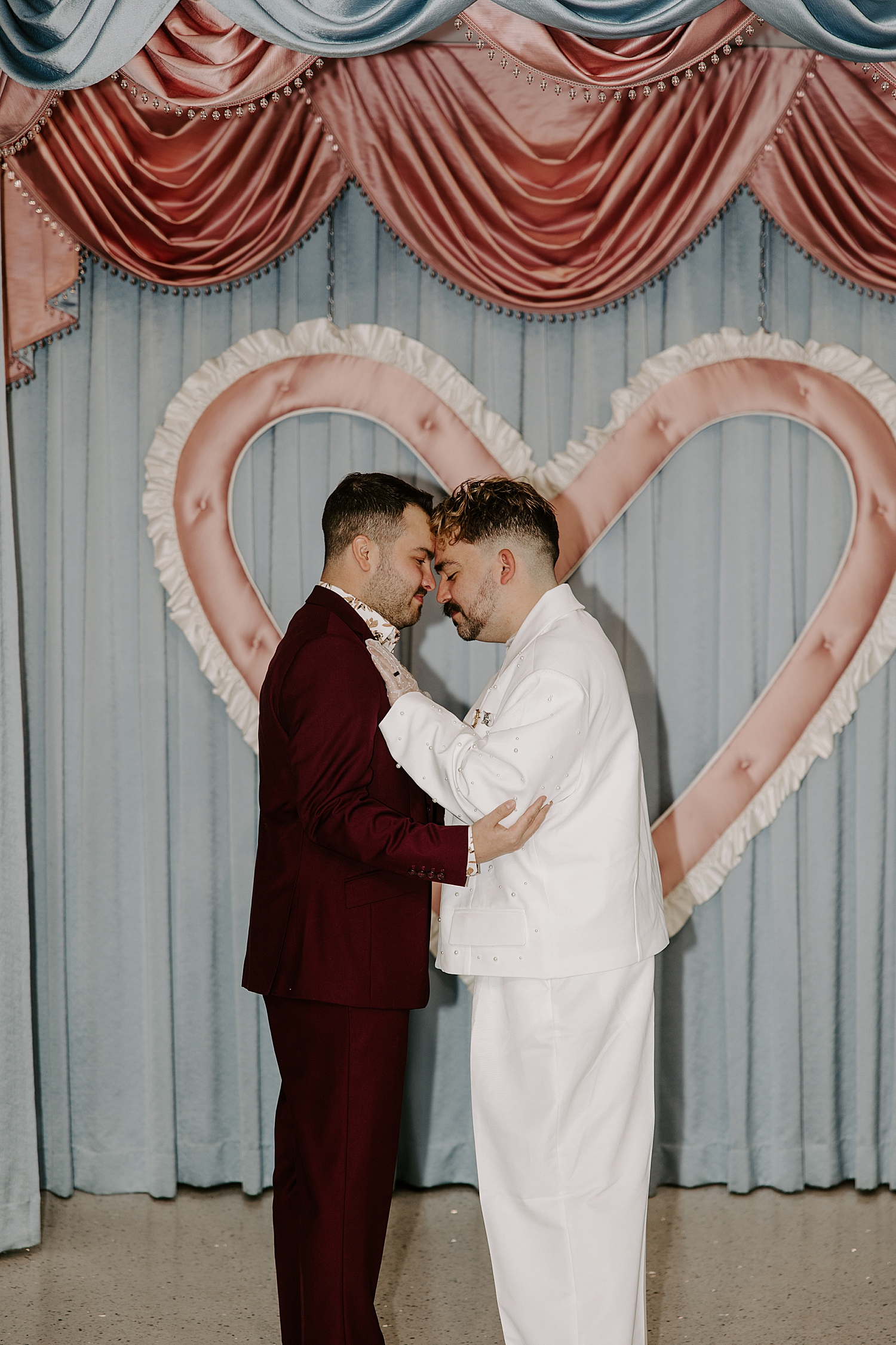 two men embrace at the alter at Sure Thing Too by Las Vegas wedding photographer