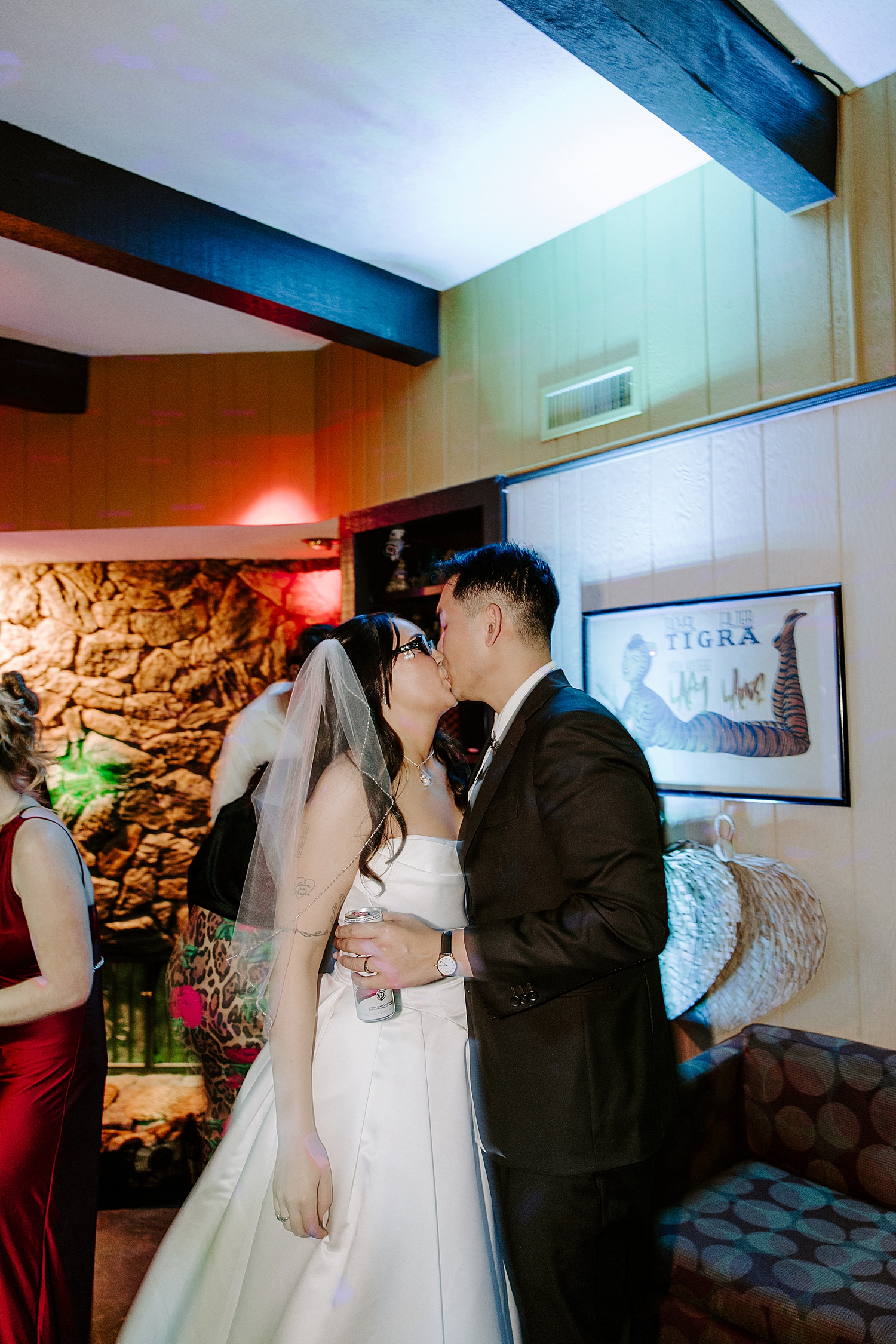 newlyweds share a kiss on dance floor by Katelyn Faye Photo